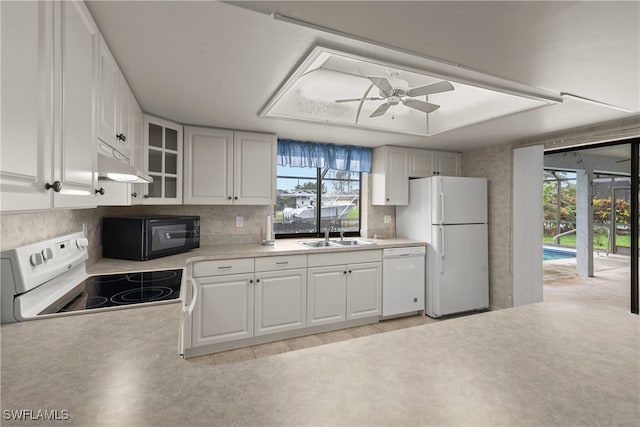 kitchen featuring ceiling fan, sink, white cabinets, and white appliances