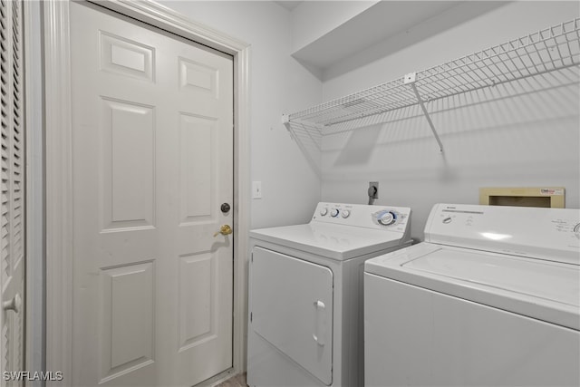 washroom with independent washer and dryer