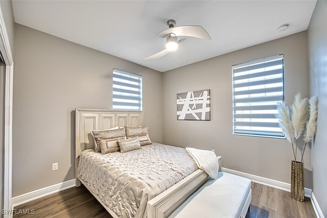 bedroom featuring dark wood-type flooring and ceiling fan