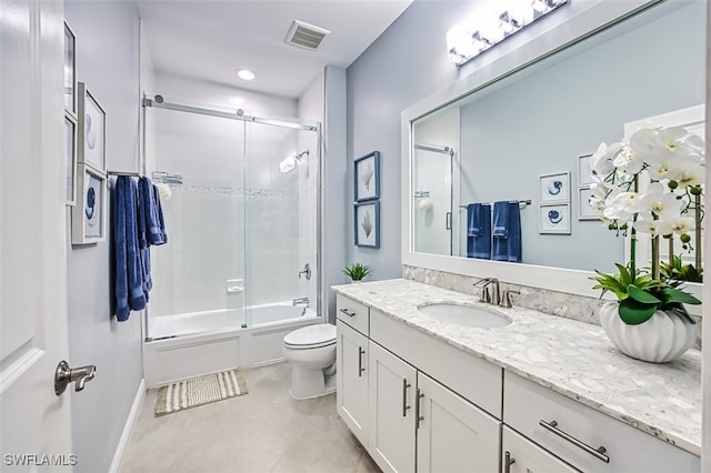 full bathroom featuring enclosed tub / shower combo, toilet, and vanity