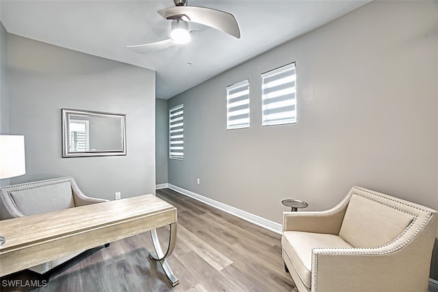 office area with light wood-type flooring and ceiling fan