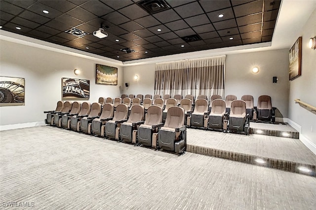 home theater room featuring a paneled ceiling and carpet floors