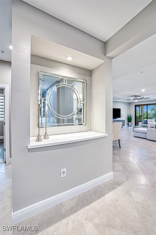 hallway featuring light tile patterned floors