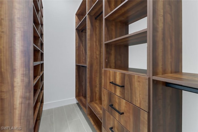 spacious closet with light tile patterned flooring