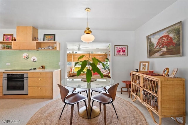 dining area featuring light carpet