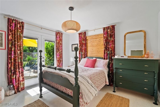 bedroom featuring access to exterior and french doors