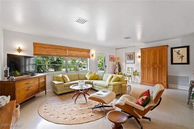 living room featuring visible vents