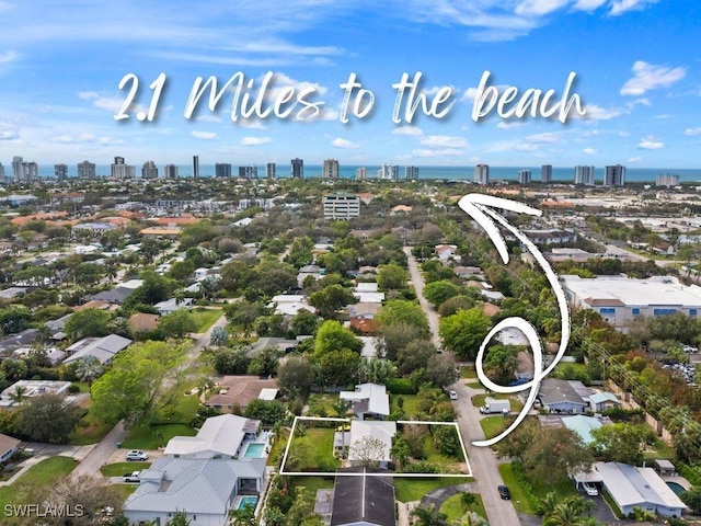 birds eye view of property featuring a city view