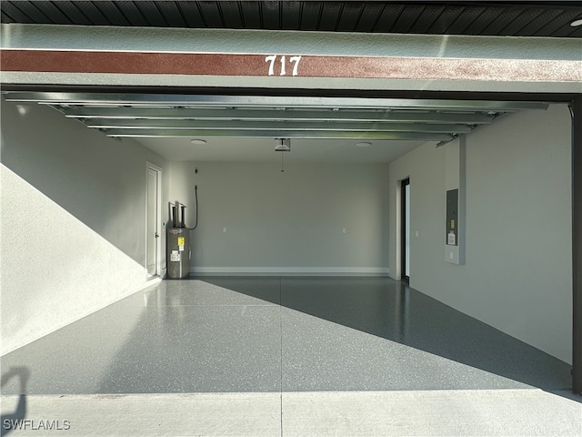 garage with electric panel and water heater