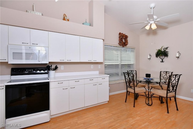 kitchen with white cabinetry, ceiling fan, and white appliances