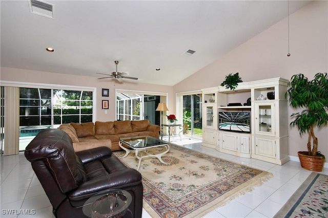 tiled living room featuring ceiling fan and lofted ceiling