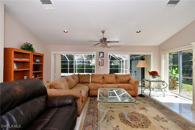 tiled living room featuring ceiling fan and lofted ceiling