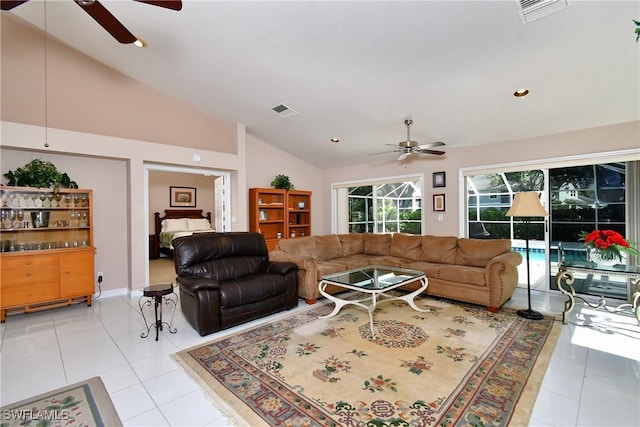 tiled living room featuring high vaulted ceiling and ceiling fan