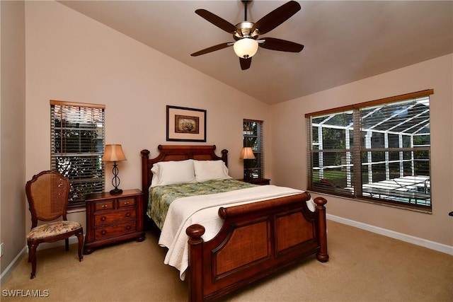 bedroom with ceiling fan, light colored carpet, and vaulted ceiling