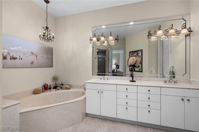 bathroom featuring a chandelier, vanity, and independent shower and bath