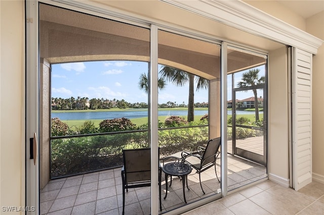 unfurnished sunroom with a water view