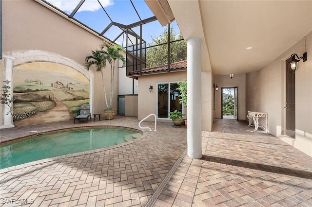 view of pool featuring a lanai and a patio