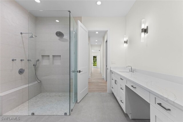 3509 5th Ave SW, Naples, FL 34117 - bathroom with recessed lighting, a tile shower, and vanity