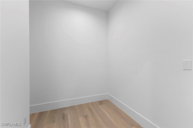 spare room with hardwood / wood-style floors