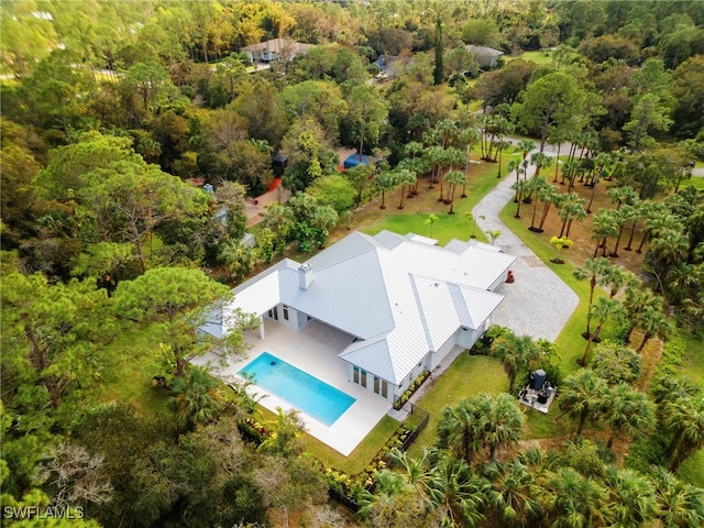 3509 5th Ave SW, Naples, FL 34117 - view from above of property with a pool and a heavily wooded area