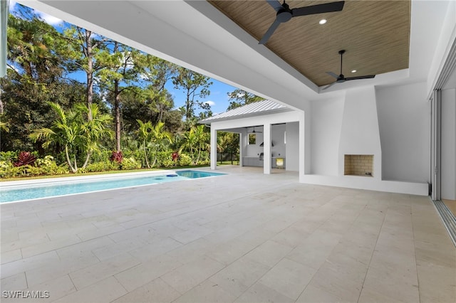 view of pool featuring a patio and ceiling fan