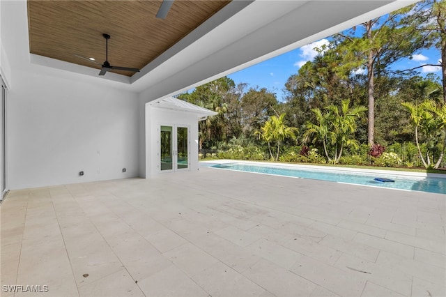 3509 5th Ave SW, Naples, FL 34117 - view of patio with a ceiling fan, an outdoor pool, and view of scattered trees