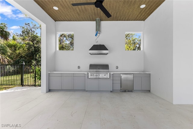 view of patio / terrace featuring an outdoor kitchen, area for grilling, and ceiling fan