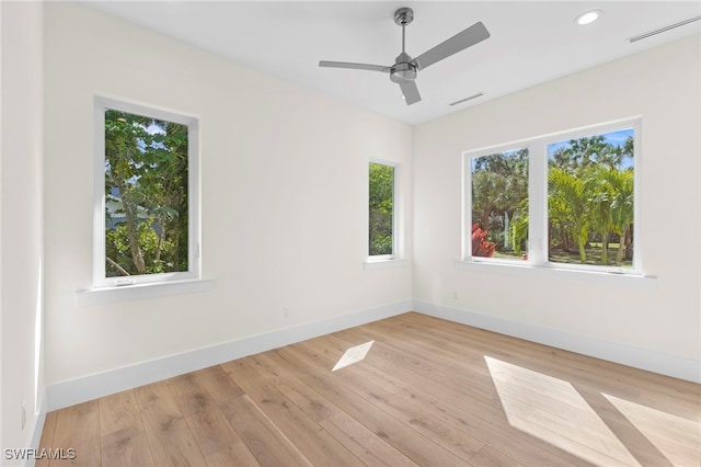 spare room with ceiling fan and light hardwood / wood-style flooring