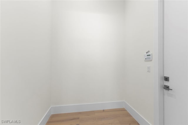3509 5th Ave SW, Naples, FL 34117 - washroom featuring light wood-type flooring and baseboards