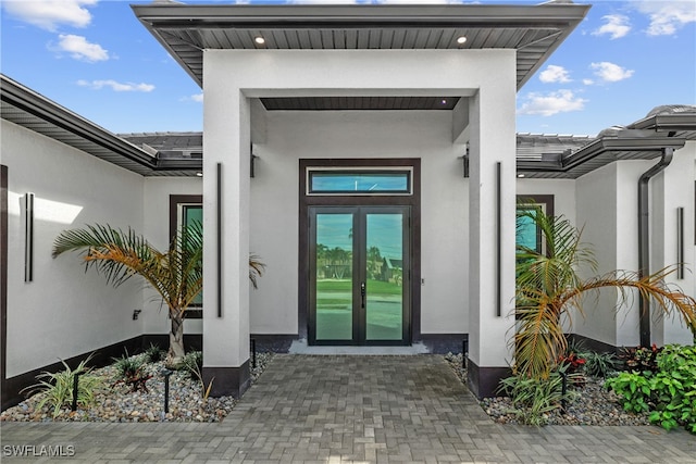 entrance to property featuring french doors