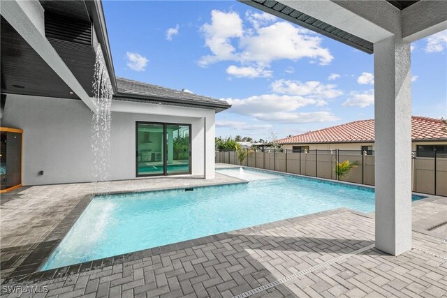 view of swimming pool with a patio area