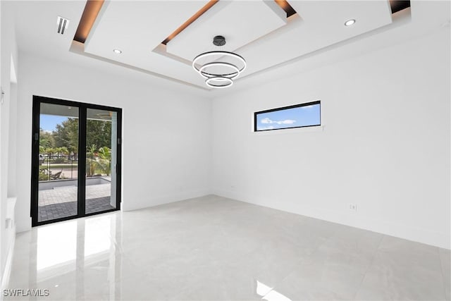 empty room with a tray ceiling