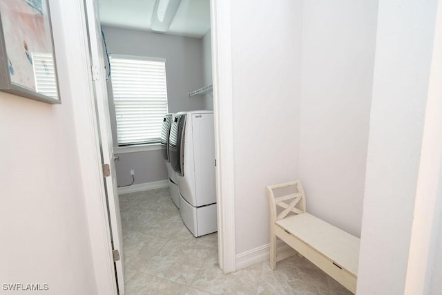 laundry area featuring a healthy amount of sunlight and washing machine and dryer