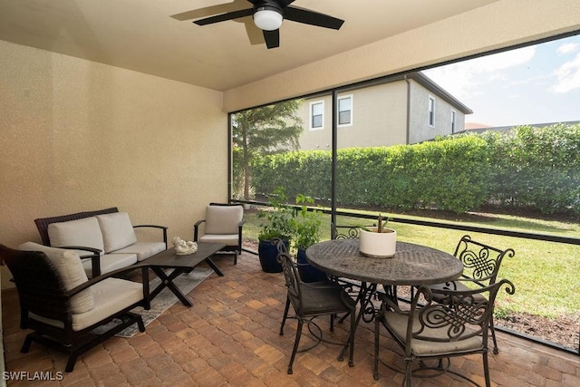 sunroom / solarium with ceiling fan