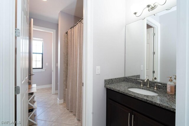 bathroom with tile patterned floors and vanity