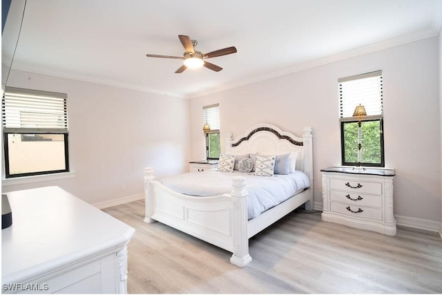 bedroom featuring ceiling fan, light hardwood / wood-style floors, and ornamental molding