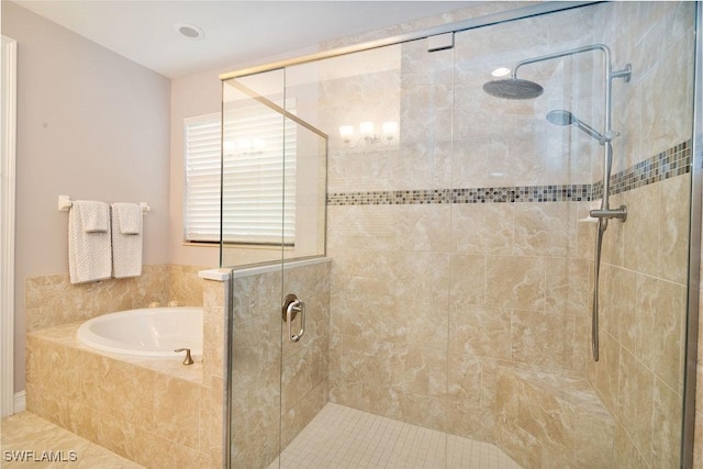 bathroom featuring tile patterned flooring and separate shower and tub