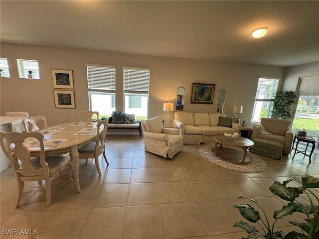 living room featuring a wealth of natural light and light tile patterned floors