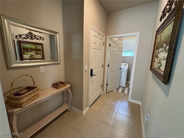 doorway with light tile patterned floors