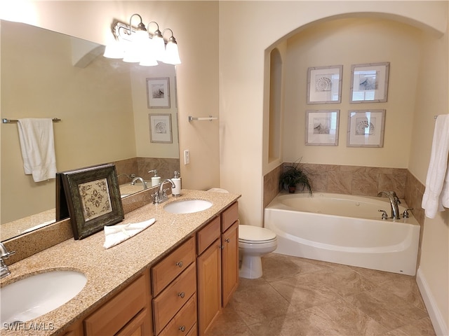 bathroom with tile patterned flooring, a bathtub, vanity, and toilet