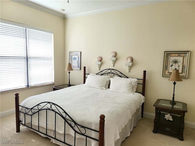 carpeted bedroom featuring ornamental molding