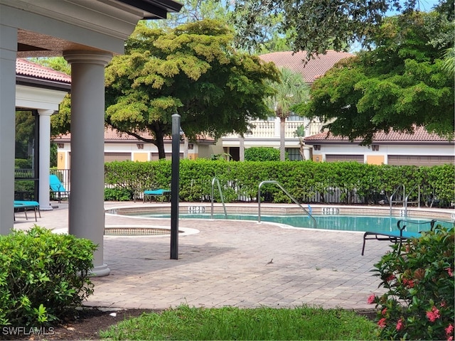 view of swimming pool featuring a patio area