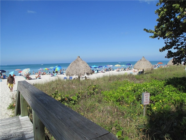 property view of water featuring a beach view