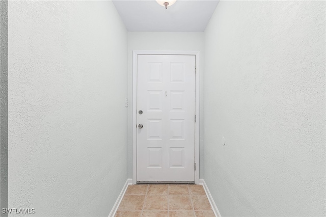 doorway featuring light tile patterned floors