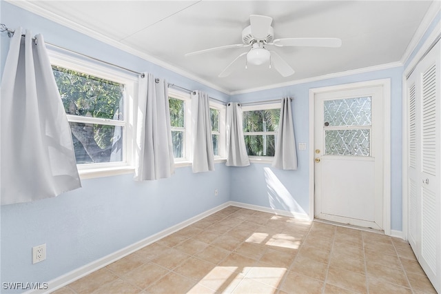 unfurnished sunroom with ceiling fan