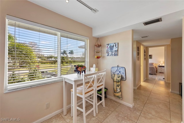 dining room with light tile patterned flooring