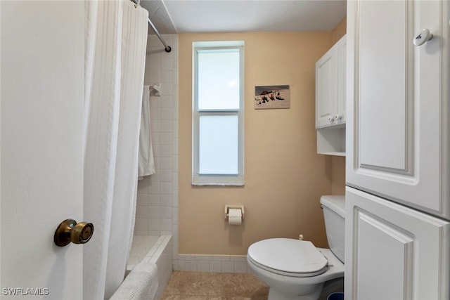 bathroom featuring toilet and tile patterned floors