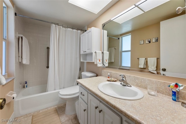 full bathroom featuring shower / bath combo, toilet, vanity, and tile patterned floors