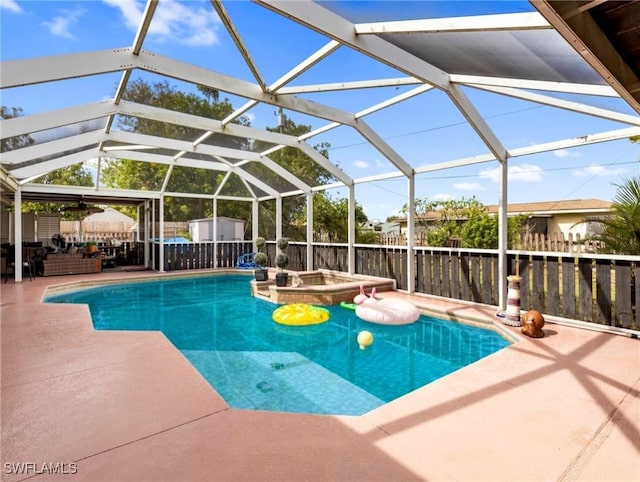 view of pool featuring a patio area and glass enclosure