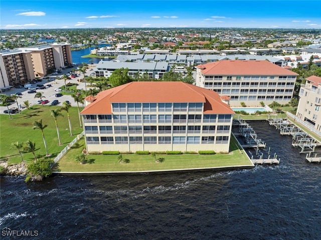 birds eye view of property featuring a water view